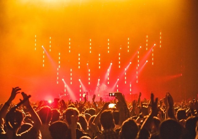 A concert night experience with the crowd lighting up their phones